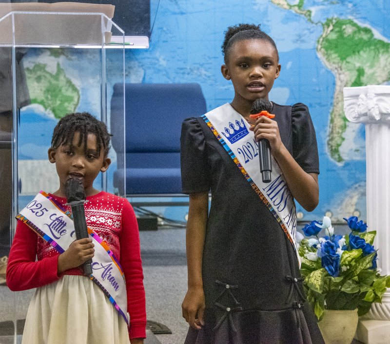 Makayla and Bryanna Harris, AFRAM Queens of 2024 and 2025, sing to open the ceremonies.